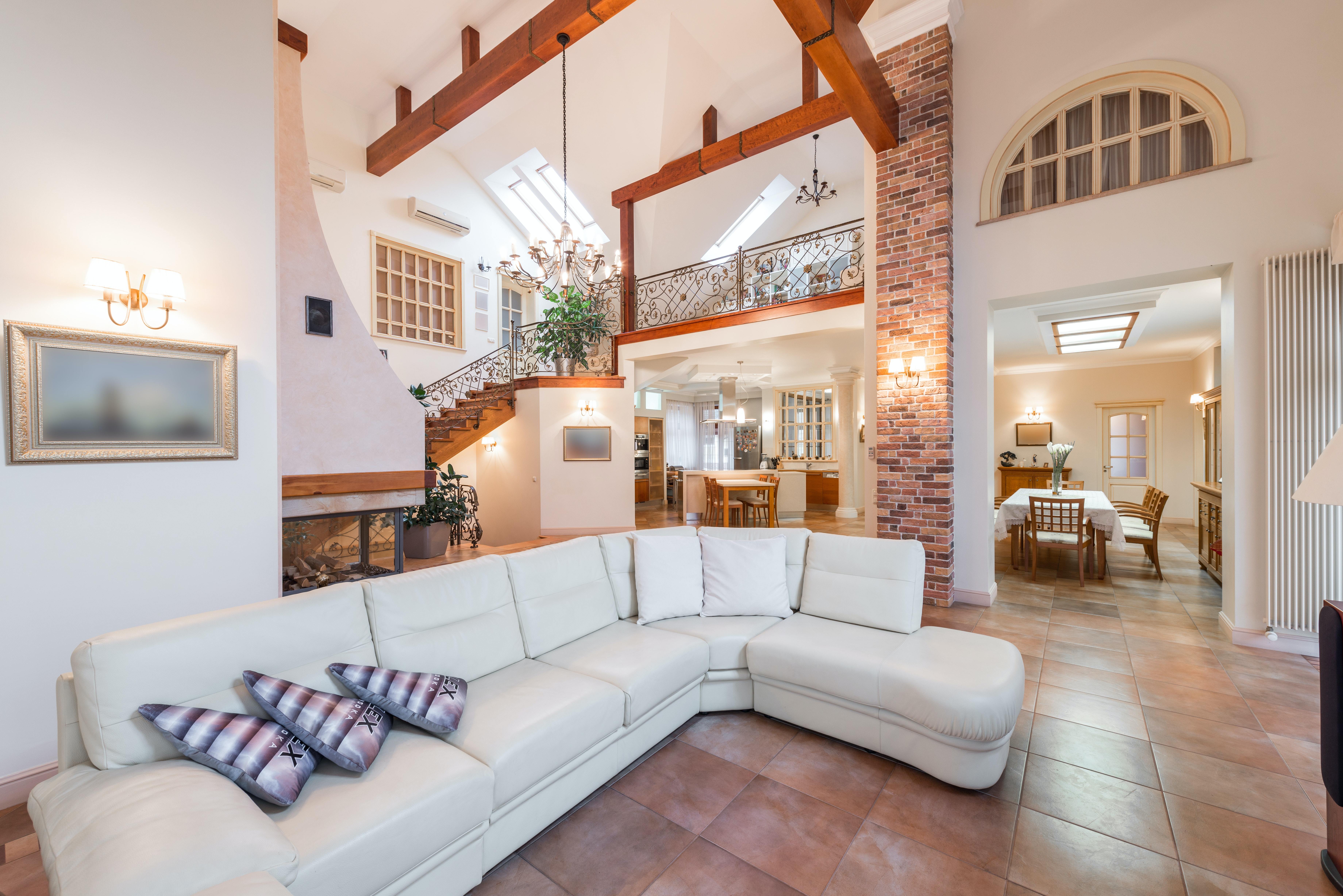 living area with view up to second level of a home